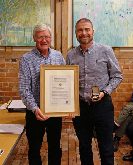 Paul Allen (right) receiving his Worcestershire Wildlife Medal from David Mortiboys (left)