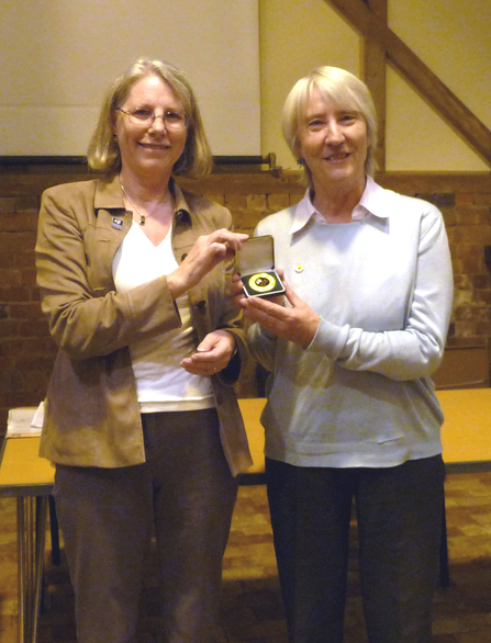 Rosemary Winnall (right) receiving her Worcestershire Wildlife Medal from Linda Butler (left)
