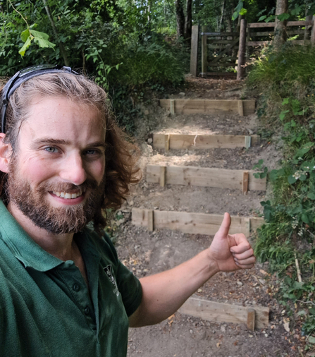 Iain with thumbs-up after working on steps (selfie)