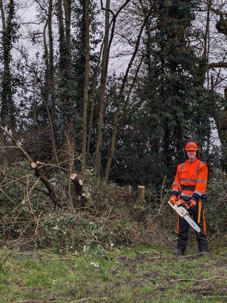 Trainee Anna with a chainsaw