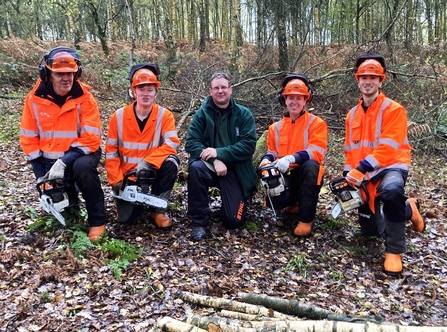 Winter trainee team with chainsaws 