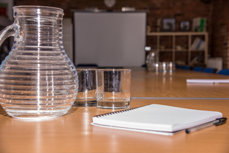 Jug in a conference room by Neil White