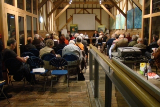 People gathered indoors for a talk