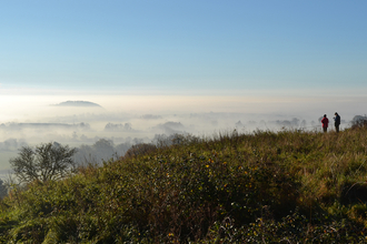 Misty Worcestershire landscape with people looking at it by Phil Ruler