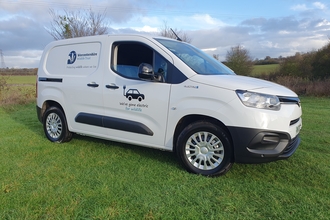 Electric van with Worcestershire Wildlife Trust logo on the side by Sean Webber