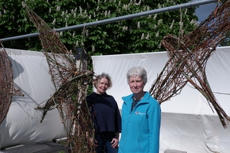 Artist Juliet Mootz (left) and Trust's Engagement Officer Julie Grainger (right) amongst woven willow sculptures on The Worcester Plinth