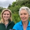 Two women looking and smiling at the camera