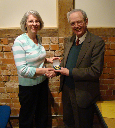 Adrian Darby (right) receiving his Worcestershire Wildlife Medal from Linda Butler (left)