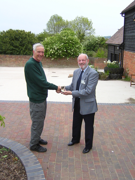 Bert Reid (left) receiving his Worcestershire Wildlife Medal from Ron Stanton (right)