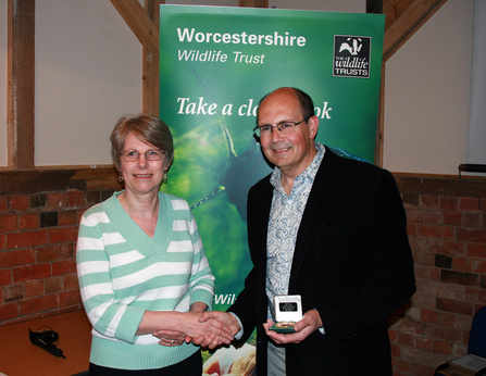Chris Dobbs (right) receiving his Worcestershire Wildlife Medal from Linda Butler (left)
