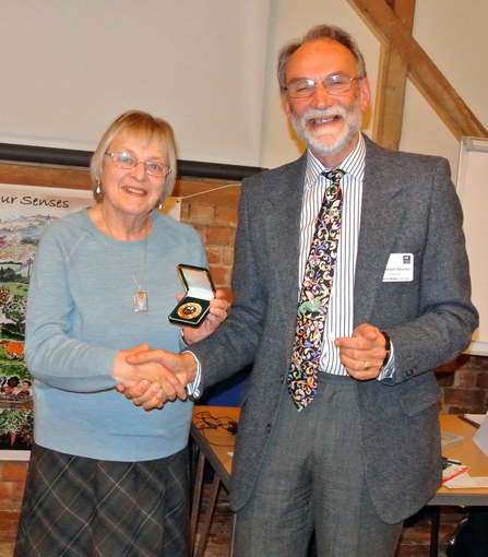 Tessa Carrick receiving her Worcestershire Wildlife Medal from Chairman Graham Martin