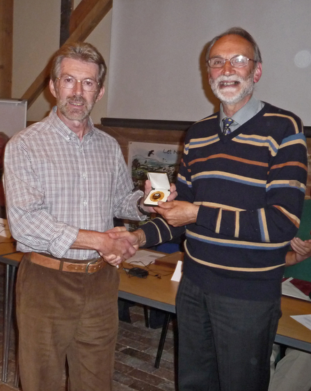 Mike Averill (left) receiving his Worcestershire Wildlife Medal from Graham Martin (right)