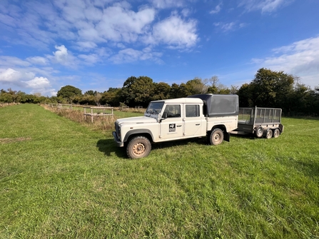 White Land Rover with Worcestershire Wildlife Trust logo on it in a field