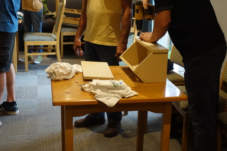People building swift boxes