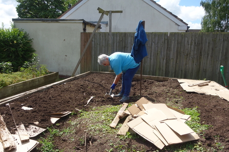 Charlotte digging in the garden