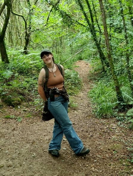 Josie stood in a woodland