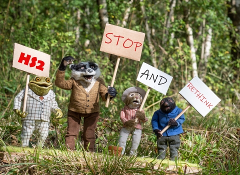 Characters from The Wind in the Willows carrying placards - HS2 Stop and Rethink